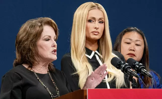 State Sen. Shannon Grove, R-Bakersfield, left, discusses her proposed bill calling on more transparency for youth treatment facilities as hotel heiress and media personalty Paris Hilton, center, listens during a news conference in Sacramento, Calif., Monday, April 15, 2024. At right is state Sen. Janet Nguyen, R-Huntington Beach. (AP Photo/Rich Pedroncelli)