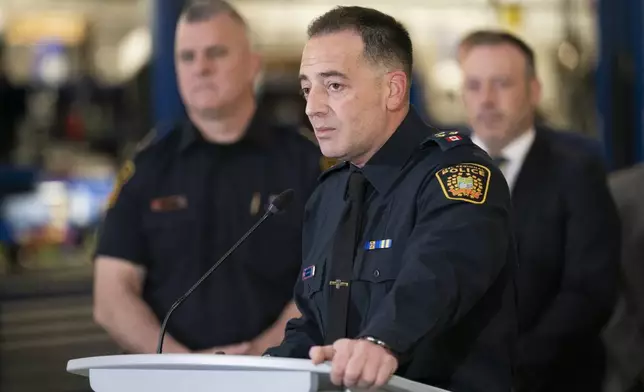 Peel Police Deputy Chief Nick Milinovich speaks to the media at a press conference regarding Project 24K a joint investigation into the theft of gold from Pearson International Airport, in Brampton, Ontario, on Wednesday, April 17, 2024. (Arlyn McAdorey/The Canadian Press via AP)