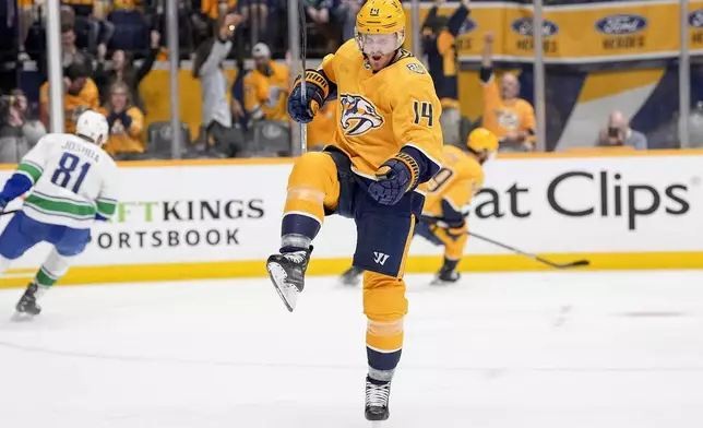 Nashville Predators center Gustav Nyquist (14) celebrates his goal against the Vancouver Canucks during the second period in Game 4 of an NHL hockey Stanley Cup first-round playoff series Sunday, April 28, 2024, in Nashville, Tenn. (AP Photo/George Walker IV)