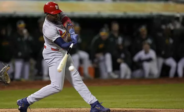 St. Louis Cardinals' Jordan Walker hits an RBI single against the Oakland Athletics during the sixth inning of a baseball game Monday, April 15, 2024, in Oakland, Calif. (AP Photo/Godofredo A. Vásquez)