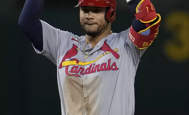 St. Louis Cardinals' Willson Contreras reacts after hitting an RBI double against the Oakland Athletics during the sixth inning of a baseball game Monday, April 15, 2024, in Oakland, Calif. (AP Photo/Godofredo A. Vásquez)