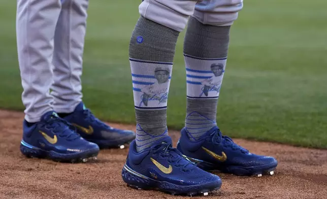 St. Louis Cardinals' Iván Herrera wears socks honoring Jackie Robinson Day before a baseball game against the Oakland Athletics, Monday, April 15, 2024, in Oakland, Calif. (AP Photo/Godofredo A. Vásquez)