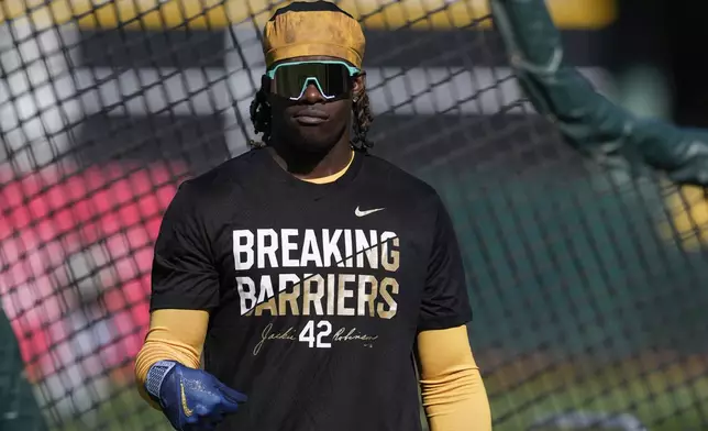 Oakland Athletics' Lawrence Butler wears a shirt for Jackie Robinson Day during batting practice before the team's baseball game against the St. Louis Cardinals, Monday, April 15, 2024, in Oakland, Calif. (AP Photo/Godofredo A. Vásquez)