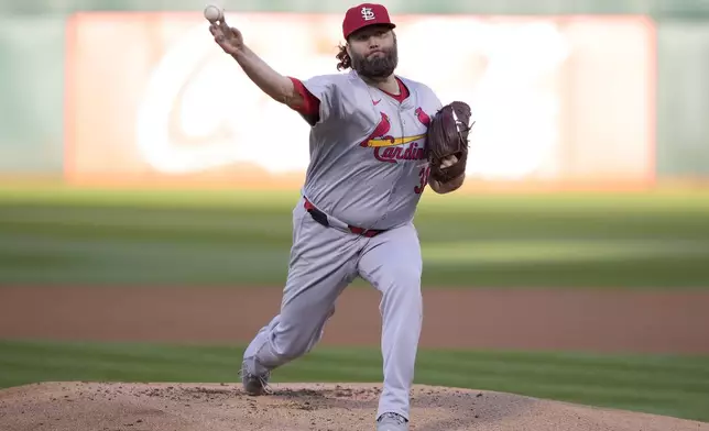 St. Louis Cardinals pitcher Lance Lynn works against the Oakland Athletics during the first inning of a baseball game in Oakland, Calif., Tuesday, April 16, 2024. (AP Photo/Tony Avelar)
