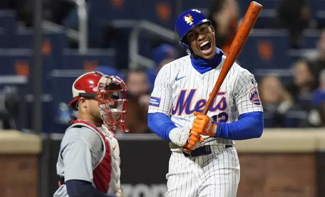 New York Mets' Francisco Lindor (12) reacts after striking out during the eighth inning of the team's baseball game against the St. Louis Cardinals, Friday, April 26, 2024, in New York. (AP Photo/Frank Franklin II)