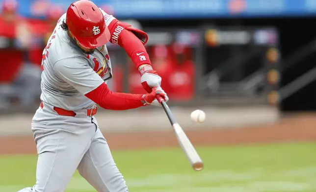 St. Louis Cardinals' Nolan Arenado hits a double against the New York Mets during the first inning of a baseball game, Saturday, April 27, 2024, in New York. (AP Photo/Noah K. Murray)