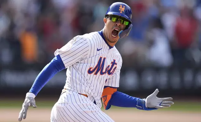 New York Mets' Mark Vientos celebrates after hitting a walkoff home run during the 11th inning of a baseball game against the St. Louis Cardinals at Citi Field, Sunday, April 28, 2024, in New York. (AP Photo/Seth Wenig)