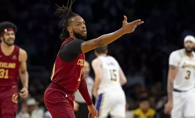 Cleveland Cavaliers guard Darius Garland (10) reacts after making a 3-point basket during the first half of an NBA basketball game against the Los Angeles Lakers, Saturday, April 6, 2024, in Los Angeles. (AP Photo/William Liang)