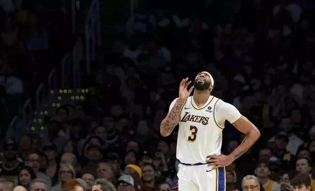 Los Angeles Lakers forward Anthony Davis (3) reacts after being called for a foul during the first half of an NBA basketball game against the Cleveland Cavaliers, Saturday, April 6, 2024, in Los Angeles. (AP Photo/William Liang)