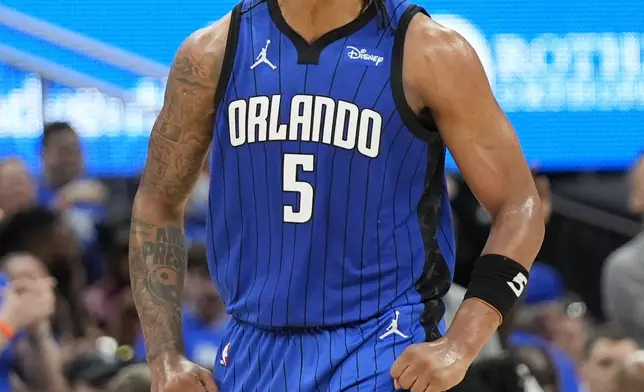 Orlando Magic forward Paolo Banchero (5) celebrates after making a 3-point shot against the Cleveland Cavaliers during the first half of Game 3 of an NBA basketball first-round playoff series Thursday, April 25, 2024, in Orlando, Fla. (AP Photo/John Raoux)