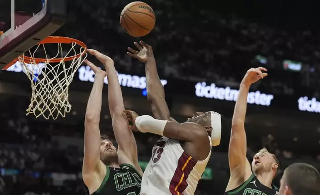 Miami Heat center Bam Adebayo (13) drives to the basket as Boston Celtics center Luke Kornet (40) defends during the second half of Game 4 of an NBA basketball first-round playoff series, Monday, April 29, 2024, in Miami. (AP Photo/Marta Lavandier)