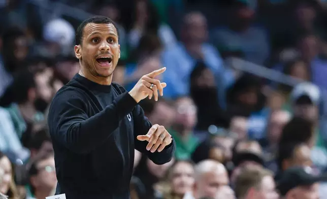 Boston Celtics head coach Joe Mazzulla directs his team against the Charlotte Hornets during the first half of an NBA basketball game in Charlotte, N.C., Monday, April 1, 2024. (AP Photo/Nell Redmond)