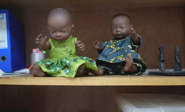 Dolls sit on a shelf in a room in a Doctors Without Borders Clinic in Bangui, Central African Republic, Monday, March 11, 2024. The dolls are used as props to help health professionals work with young children who have been sexually assaulted. Sexual assaults and other cases of gender-based violence are rising in Central African Republic. The alleged attackers include everyone from Wagner mercenaries to bandits to United Nations peacekeepers. Reasons include ongoing conflict in one of the world's most volatile countries, a weak legal system and the stigma of speaking up. (AP Photo/Sam Mednick)