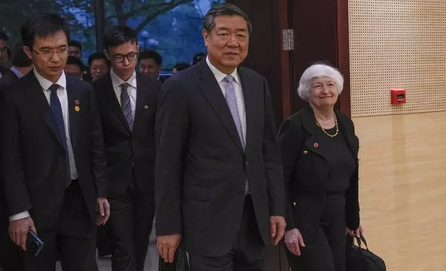 U.S. Treasury Secretary Janet Yellen, right, and Chinese Vice Premier He Lifeng, center, arrive to a bilateral meeting at the Guangdong Zhudao Guest House in southern China's Guangdong province, Saturday, April 6, 2024. (AP Photo/Andy Wong, Pool)