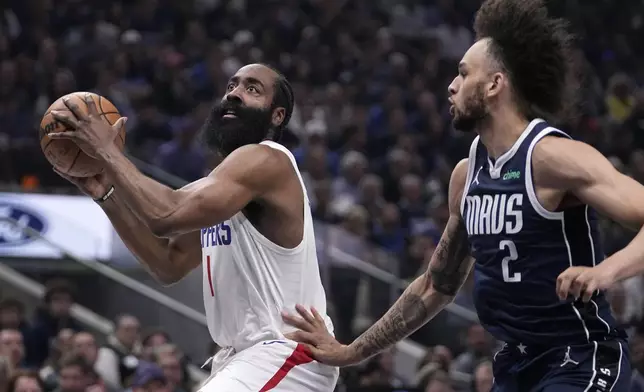 Los Angeles Clippers guard James Harden drives to the basket as Dallas Mavericks' Dereck Lively II (2) defends during the first half in Game 2 of an NBA basketball first-round playoff series Friday, April 26, 2024, in Dallas. (AP Photo/Tony Gutierrez)