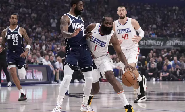Los Angeles Clippers' James Harden (1) works around Dallas Mavericks guard Kyrie Irving during the first half of Game 2 of an NBA basketball first-round playoff series Friday, April 26, 2024, in Dallas. (AP Photo/Tony Gutierrez)