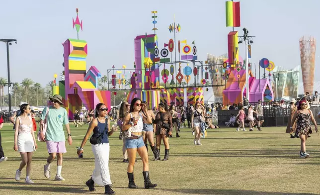 Festivalgoers are seen during the the first weekend of the Coachella Valley Music and Arts Festival at the Empire Polo Club on Friday, April 12, 2024, in Indio, Calif. (Photo by Amy Harris/Invision/AP)