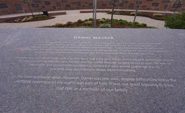 The plaque to honor Daniel Mauser, one of the 12 students killed during the massacre at Columbine High School nearly 25 years ago, is displayed at the Columbine Memorial Wednesday, April 17, 2024, in Littleton, Colo. Trauma still shadows the survivors of the horrific Columbine High School shooting as the attack's 25th anniversary approaches. (AP Photo/David Zalubowski)