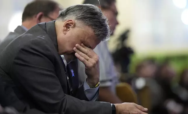 Columbine High School principal Frank DeAngelis reacts during a vigil remembering the 25th anniversary of the Columbine High School mass shooting, Friday, April 19, 2024, in Denver. (AP Photo/Jack Dempsey)