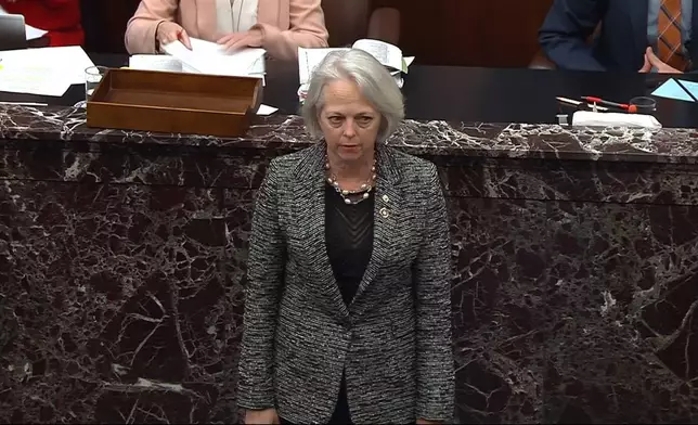 In this image from video from Senate Television, Senate Sergeant at Arms Karen Gibson makes the proclamation during the impeachment trial of Homeland Security Secretary Alejandro Mayorkas on the Senate floor at the U.S. Capitol, Wednesday, April 17, 2024, in Washington. (Senate Television via AP)