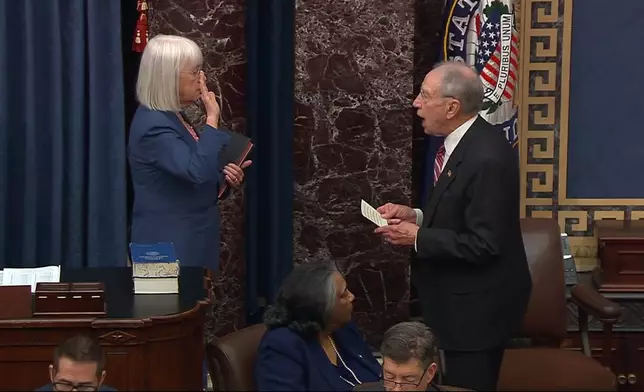 In this image from video from Senate Television, Sen. Patty Murray, D-Wash., is sworn in to preside by Sen. Chuck Grassley, R-Iowa, during the impeachment trial of Homeland Security Secretary Alejandro Mayorkas on the Senate floor at the U.S. Capitol, Wednesday, April 17, 2024, in Washington. (Senate Television via AP)