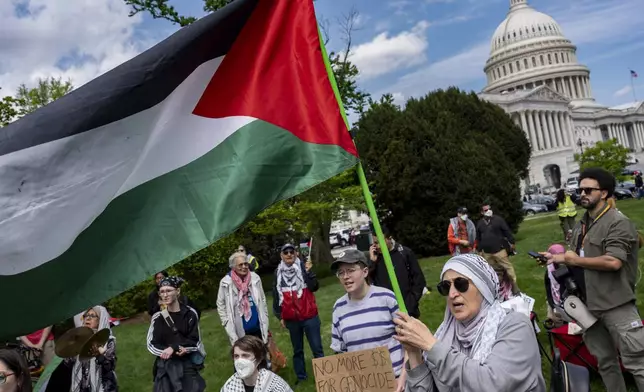 Pro-Palestinian activists demonstrate outside the Capitol in Washington, Saturday, April 20, 2024, as the House prepares to vote on approval of $95 billion in foreign aid for Ukraine, Israel and other U.S. allies. (AP Photo/J. Scott Applewhite)