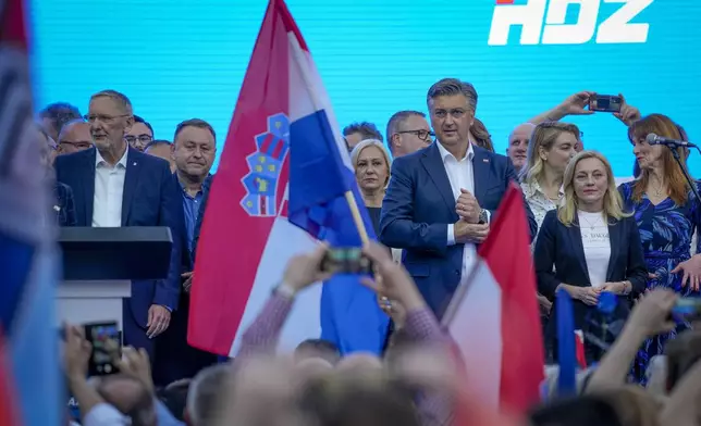 Prime Minister incumbent Andrej Plenkovic, centre right, attends his party's rally in Zagreb, Croatia, Sunday, April 14, 2024. Croatia this week holds an early parliamentary election following a campaign that was marked by heated exchanges between the country's two top officials, creating a political crisis in the Balkan country, a European Union and NATO member state. (AP Photo/Darko Bandic)