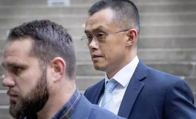 FILE - Binance founder and CEO Changpeng Zhao, right, leaves federal court in Seattle on Nov. 21, 2023, after pleading guilty to violations of U.S. anti-money laundering laws. Zhao, the founder of Binance, the world's largest cryptocurrency exchange, faces sentencing Tuesday, April 30, 2024, in Seattle, where U.S. prosecutors are asking a judge to give him a three-year prison term for allowing rampant money laundering on the platform. (Ken Lambert/The Seattle Times via AP, File)