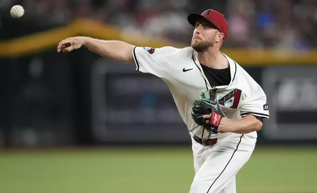 Arizona Diamondbacks starting pitcher Merril Kelly throws against the Chicago Cubs during the fifth inning of a baseball game, Monday, April 15, 2024, in Phoenix. (AP Photo/Matt York)