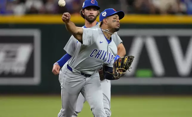 Chicago Cubs' Christopher Morel fields a ground out hit by Arizona Diamondbacks' Gabriel Moreno during the fifth inning of a baseball game, Monday, April 15, 2024, in Phoenix. (AP Photo/Matt York)