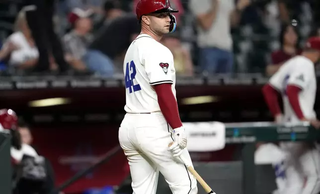 Arizona Diamondbacks' Christian Walker looks towards the mound after striking out to end the baseball game against the Chicago Cubs, Monday, April 15, 2024, in Phoenix. The Cubs defeated the Diamondbacks 3-2. (AP Photo/Matt York)