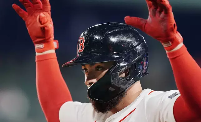 Boston Red Sox's Connor Wong reacts after hitting an RBI single during the third inning of a baseball game against the Chicago Cubs, Sunday, April 28, 2024, in Boston. (AP Photo/Michael Dwyer)