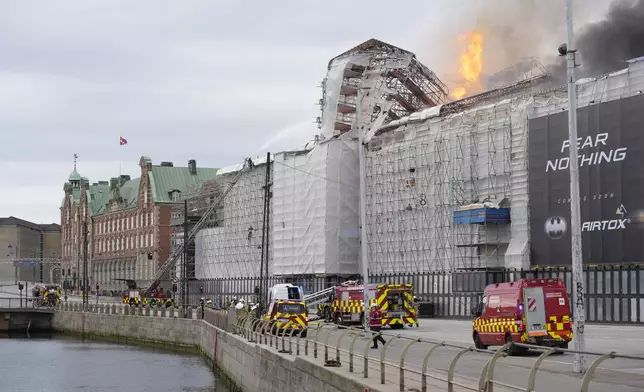 Fire and smoke rise out of the Old Stock Exchange, Boersen, in Copenhagen, Denmark, Tuesday, April 16, 2024. (Emil Helms/Ritzau Scanpix via AP)