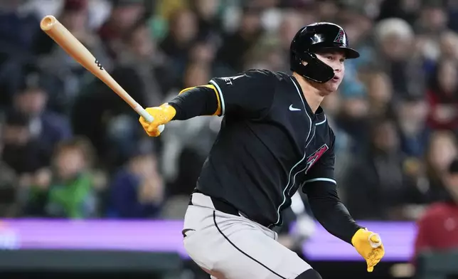 Arizona Diamondbacks' Joc Pederson hits a double against the Seattle Mariners during the seventh inning of a baseball game Sunday, April 28, 2024, in Seattle. (AP Photo/Lindsey Wasson)