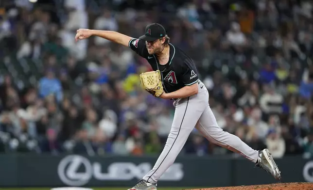Arizona Diamondbacks relief pitcher Kevin Ginkel throws against the Seattle Mariners during the ninth inning of a baseball game Sunday, April 28, 2024, in Seattle. (AP Photo/Lindsey Wasson)