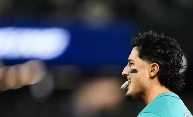 Seattle Mariners' Josh Rojas reacts after grounding out against the Arizona Diamondbacks to end the third inning of a baseball game Saturday, April 27, 2024, in Seattle. (AP Photo/Lindsey Wasson)
