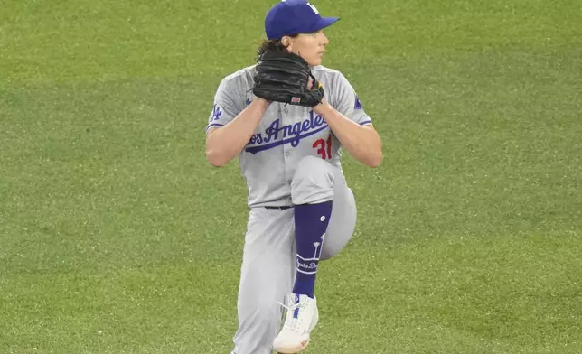 Los Angeles Dodgers pitcher Tyler Glasnow works against the Toronto Blue Jays during the sixth inning of a baseball game in Toronto, Saturday, April 27, 2024. (Chris Young/The Canadian Press via AP)