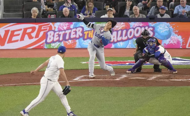 Toronto Blue Jays pitcher Yusei Kikuchi strikes out Los Angeles Dodgers designated hitter Shohei Ohtani during the fourth inning of a baseball game in Toronto, Saturday, April 27, 2024. (Chris Young/The Canadian Press via AP)