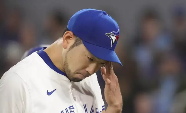 Toronto Blue Jays pitcher Yusei Kikuchi walks off the mound at the end of the third inning of a baseball game against the Los Angeles Dodgers in Toronto, Saturday, April 27, 2024. (Chris Young/The Canadian Press via AP)