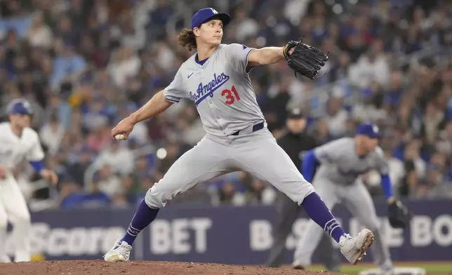 Los Angeles Dodgers pitcher Tyler Glasnow works against the Toronto Blue Jays during second inning of a baseball game in Toronto, Saturday, April 27, 2024. (Chris Young/The Canadian Press via AP)