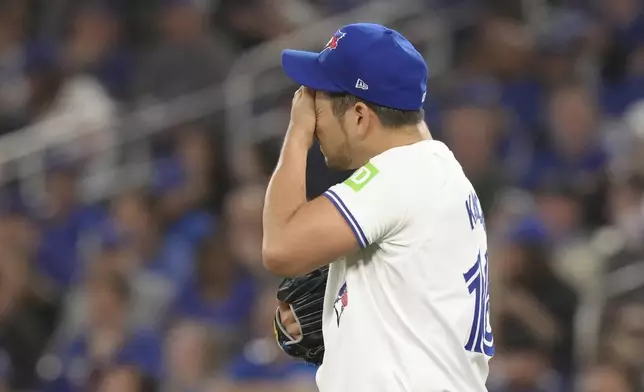 Toronto Blue Jays pitcher Yusei Kikuchi reacts during the second inning of a baseball game against the Los Angeles Dodgers in Toronto on Saturday, April 27, 2024. (Chris Young/The Canadian Press via AP)