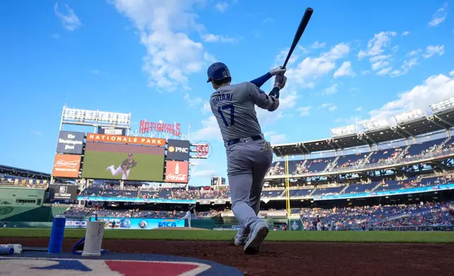 Los Angeles Dodgers designated hitter Shohei Ohtani waits to bat during the first inning of the team's baseball game against the Washington Nationals at Nationals Park, Wednesday, April 24, 2024, in Washington.(AP Photo/Alex Brandon)