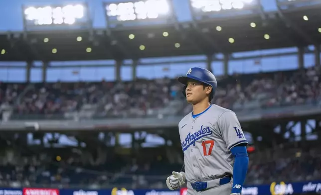 Los Angeles Dodgers designated hitter Shohei Ohtani jogs back to the dugout during the fourth inning of the team's baseball game against the Washington Nationals at Nationals Park, Wednesday, April 24, 2024, in Washington. (AP Photo/Alex Brandon)