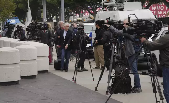 News crews line up outside federal court for Ippei Mizuhara, the former longtime interpreter for Los Angeles Dodgers star Shohei Ohtani, Friday, April 12, 2024, in Los Angeles. Mizuhara is charged with federal bank fraud, alleging that he stole more than $16 million from the Japanese sensation to cover gambling bets and debts, federal authorities said. (AP Photo/Damian Dovarganes)