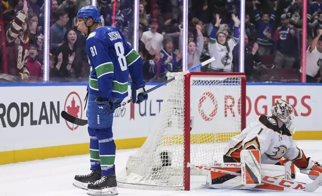 Vancouver Canucks' Dakota Joshua (81) celebrates his second goal against Anaheim Ducks goalie Lukas Dostal (1), during the third period of an NHL hockey game Sunday, March 31, 2024, in Vancouver, British Columbia. (Darryl Dyck/The Canadian Press via AP)