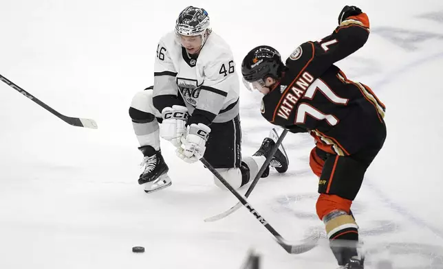 Los Angeles Kings center Blake Lizotte, left, and Anaheim Ducks right wing Frank Vatrano vie for the puck during the first period of an NHL hockey game Saturday, April 13, 2024, in Los Angeles. (AP Photo/Mark J. Terrill)