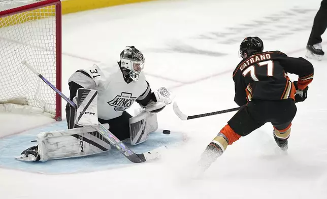 Los Angeles Kings goaltender David Rittich, left, stops a shot by Anaheim Ducks right wing Frank Vatrano during the second period of an NHL hockey game Saturday, April 13, 2024, in Los Angeles. (AP Photo/Mark J. Terrill)