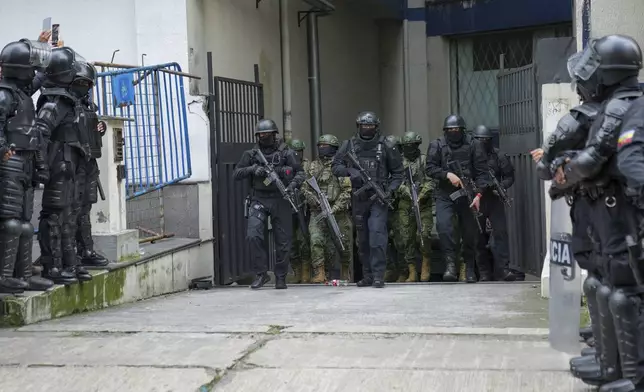 Police and soldiers guard the detention center where former Ecuadorian Vice President Jorge Glas was held after police broke into the Mexican Embassy to arrest him in Quito, Ecuador, Saturday, April 6, 2024. Glas, who held the vice presidency of Ecuador between 2013 and 2018, was convicted of corruption and had been taking refuge in the embassy since December. (AP Photo/Dolores Ochoa)