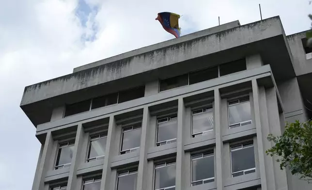 The Venezuelan flag flies over the building where the Venezuelan embassy is located in Quito, Ecuador, Tuesday, April 16, 2024. Venezuelan President Nicolás Maduro ordered the closure of his country's embassy and consulates in Ecuador on Tuesday in solidarity with Mexico in its protest over a raid by Ecuadorian authorities on the Mexican embassy in Quito. (AP Photo/Dolores Ochoa)