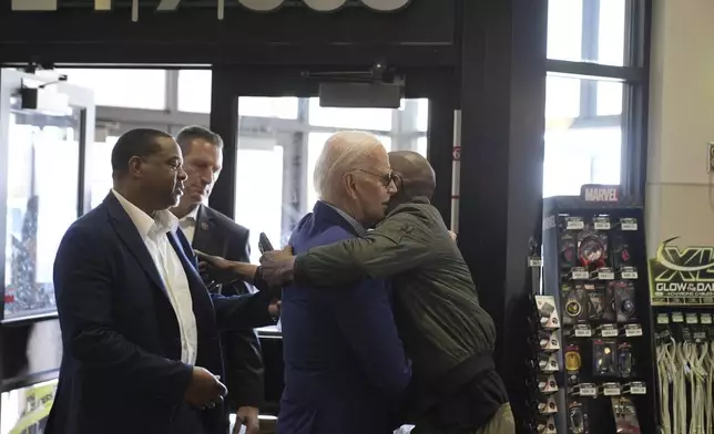 President Joe Biden is greeted after walking into a Sheetz after stopping enroute to Pittsburgh International Airport, Wednesday, April 17, 2024, in Pittsburgh, Pa. (AP Photo/Alex Brandon))